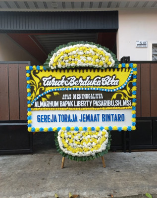 Papan Bunga Duka di Angin Nauli